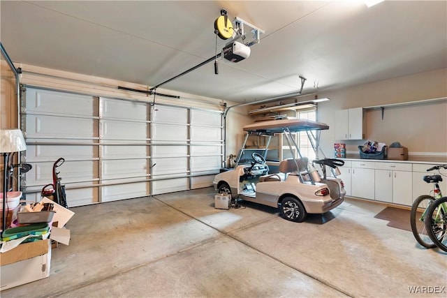 garage featuring a garage door opener