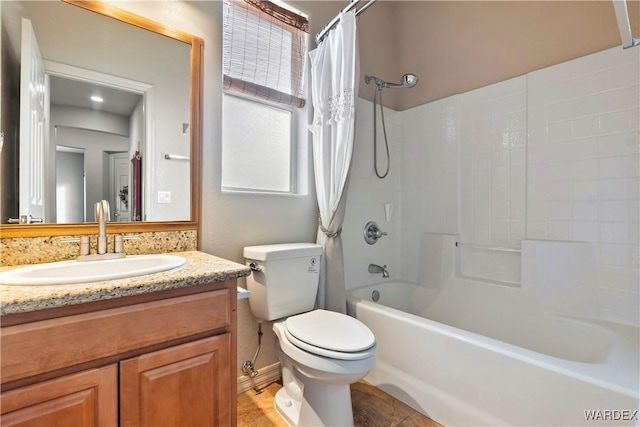 bathroom featuring toilet, shower / tub combo with curtain, and vanity