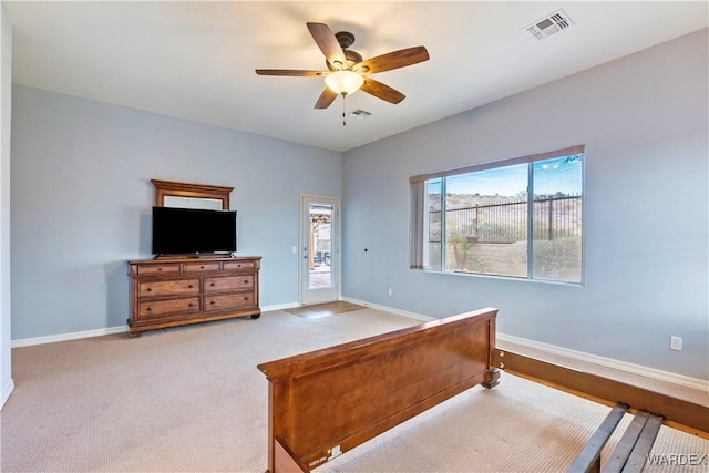 bedroom featuring light carpet, baseboards, visible vents, and ceiling fan