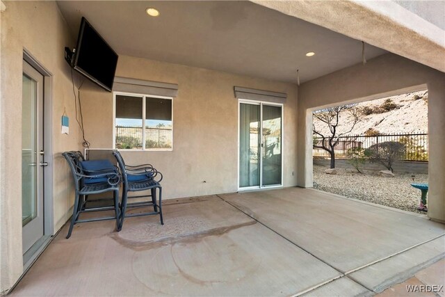 view of patio / terrace featuring fence