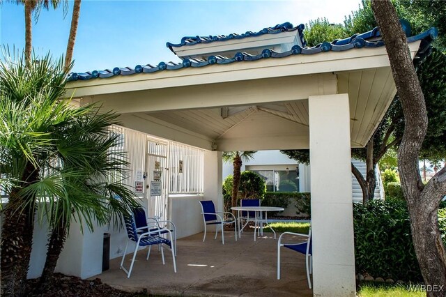 view of patio / terrace featuring a gazebo and outdoor dining space