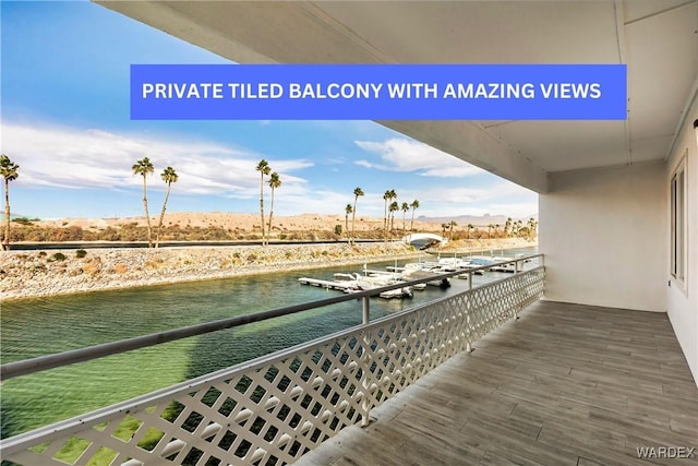 balcony featuring a water view