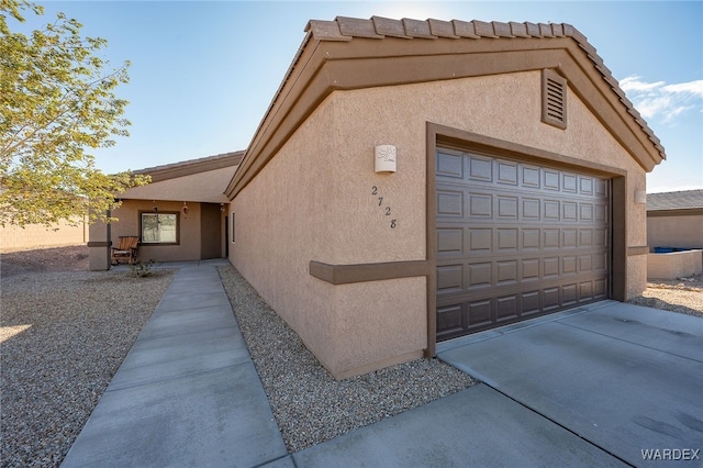 exterior space featuring concrete driveway