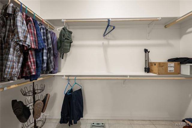 spacious closet featuring light tile patterned floors