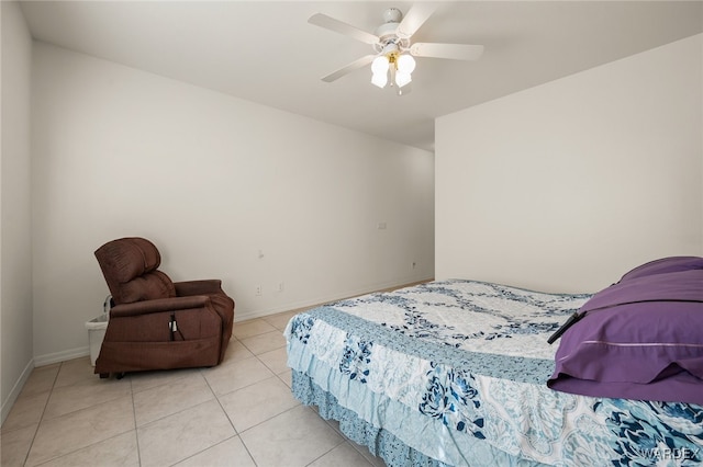 bedroom featuring a ceiling fan, light tile patterned flooring, and baseboards