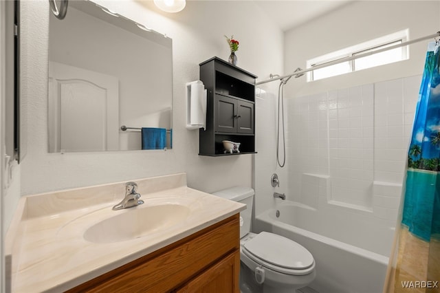 full bath featuring shower / bath combo, vanity, and toilet