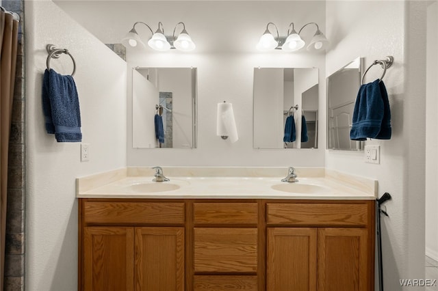 full bath featuring double vanity and a sink