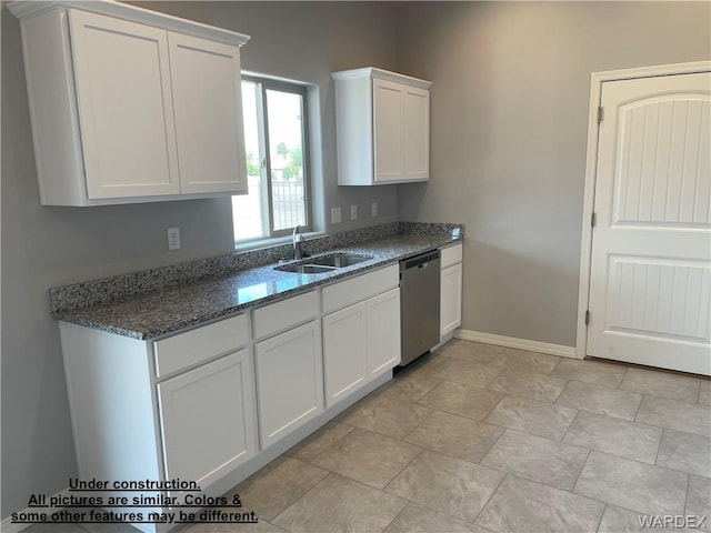 4939 N Famoso Dr, Kingman, AZ 86409 - kitchen with a sink, dishwasher, white cabinetry, dark stone counters, and baseboards