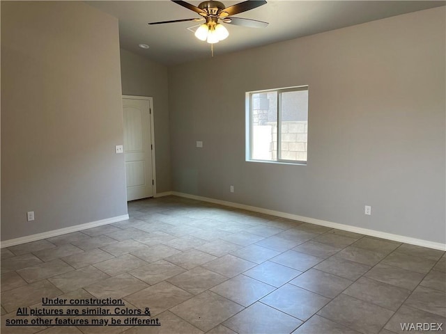 4939 N Famoso Dr, Kingman, AZ 86409 - empty room with ceiling fan, baseboards, and vaulted ceiling