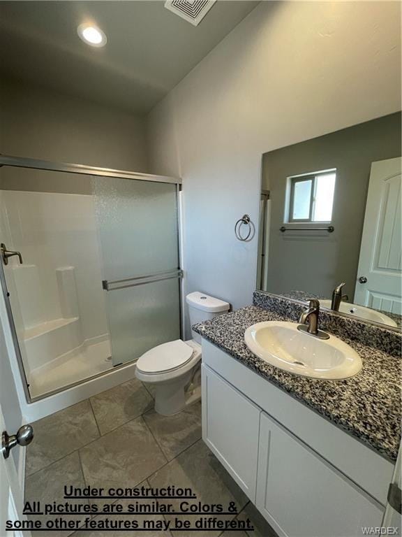 4939 N Famoso Dr, Kingman, AZ 86409 - bathroom with a shower stall, vanity, and toilet
