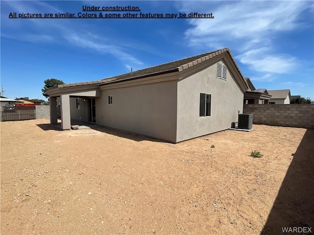 4939 N Famoso Dr, Kingman, AZ 86409 - back of house with central AC unit and stucco siding