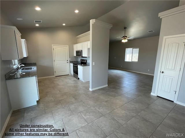 4939 N Famoso Dr, Kingman, AZ 86409 - kitchen featuring electric stove, stainless steel microwave, a ceiling fan, a sink, and baseboards