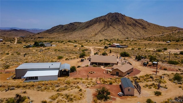 aerial view featuring a desert view and a mountain view