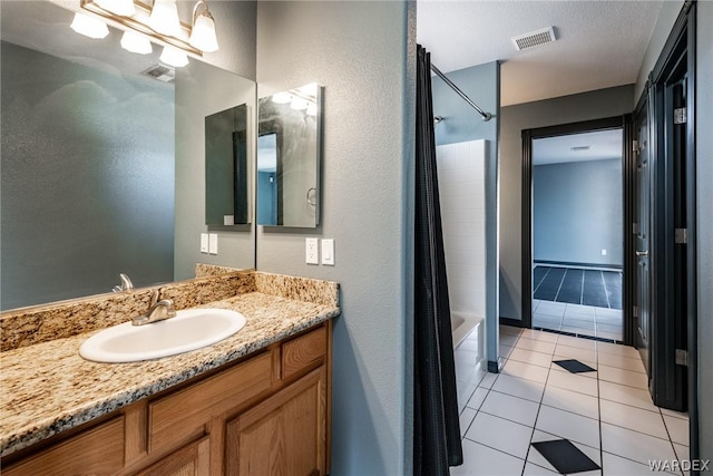 full bath featuring shower / bathtub combination with curtain, visible vents, tile patterned flooring, and vanity