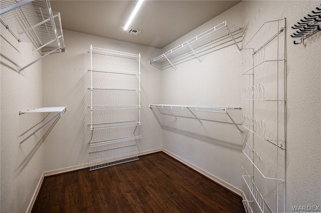 spacious closet with visible vents and wood finished floors