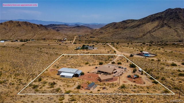 drone / aerial view with a mountain view and a desert view