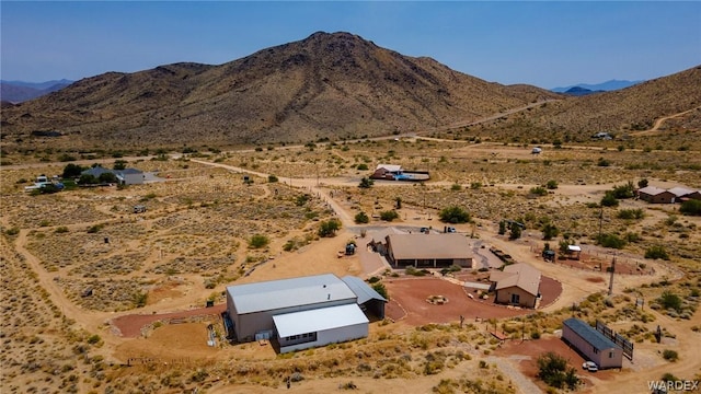 bird's eye view with view of desert and a mountain view