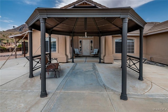 view of patio / terrace featuring a carport and a gazebo