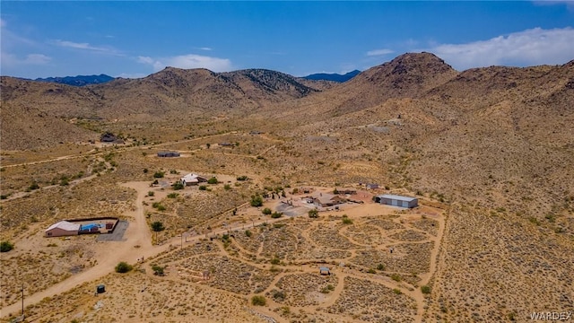 bird's eye view with a mountain view and view of desert