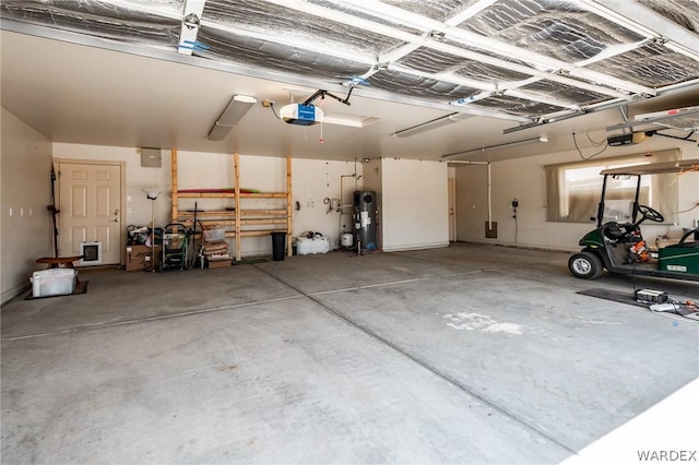 garage with water heater and a garage door opener