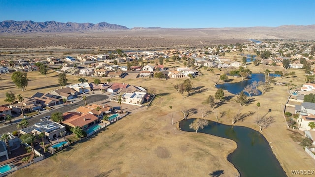 aerial view with a residential view and a water and mountain view