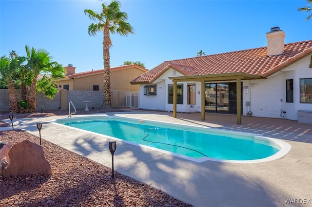 view of pool featuring a patio area, fence, and a fenced in pool