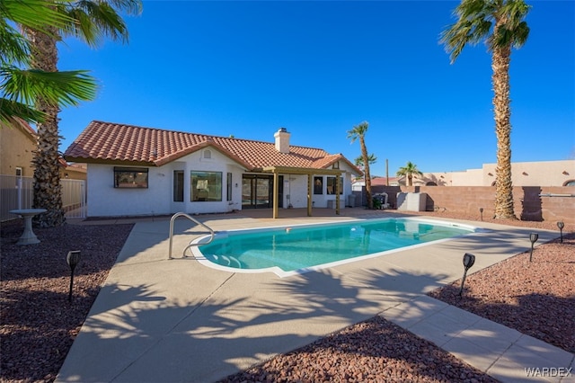 view of pool with a fenced in pool, a patio, and fence