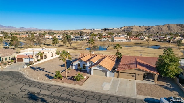 drone / aerial view with a residential view and a mountain view