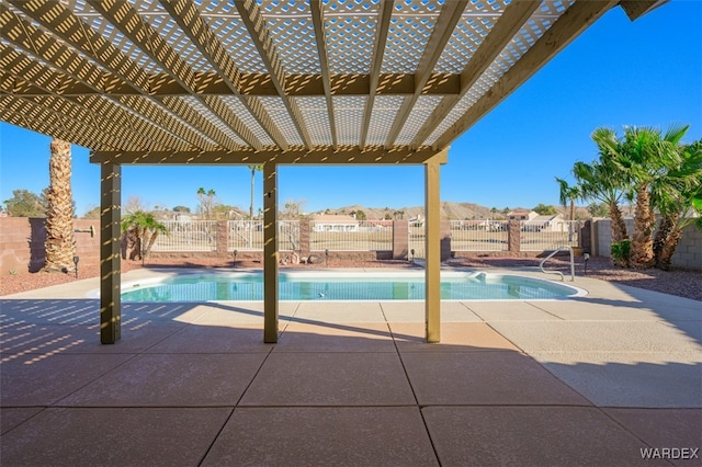 view of pool with fence, a fenced in pool, and a pergola