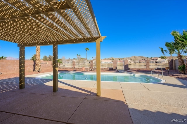 view of pool with a fenced in pool, a patio area, fence, and a pergola