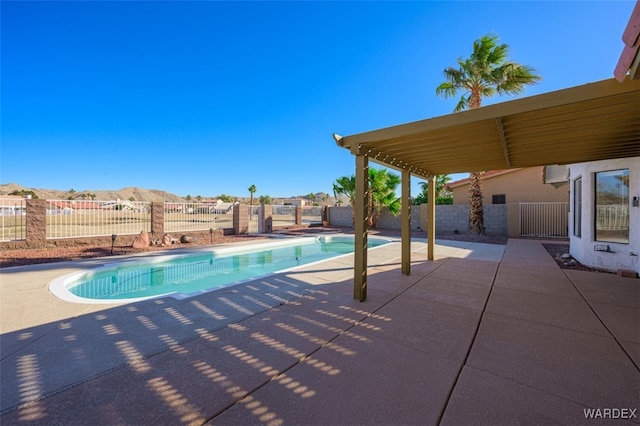 view of swimming pool with a patio area, a fenced backyard, and a fenced in pool