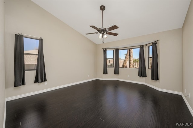 unfurnished room featuring ceiling fan, vaulted ceiling, baseboards, and wood finished floors