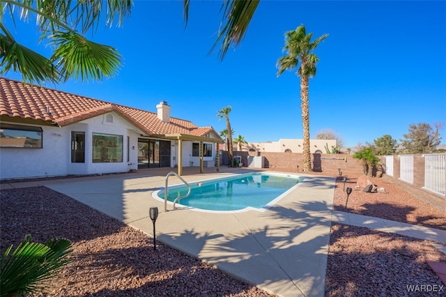 view of swimming pool featuring a fenced in pool, a patio area, and a fenced backyard