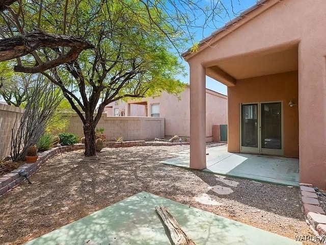 view of patio / terrace featuring fence