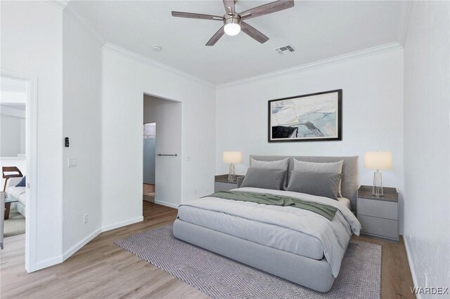 bedroom featuring crown molding, wood finished floors, visible vents, and baseboards