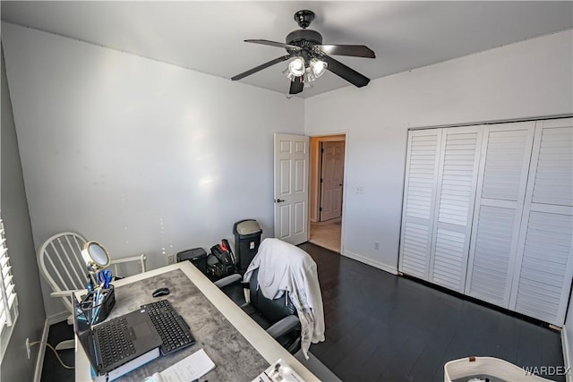 home office with baseboards, dark wood finished floors, and a ceiling fan