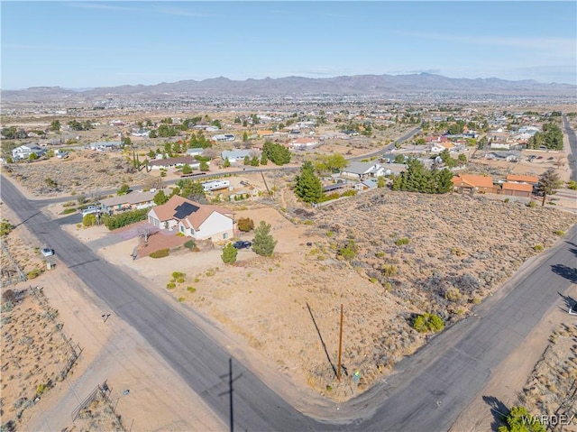 drone / aerial view with a desert view and a mountain view