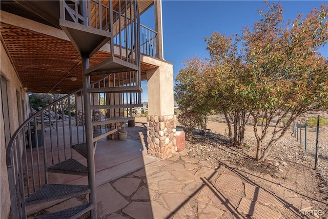 view of patio / terrace featuring stairs