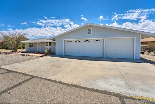 single story home featuring an attached garage