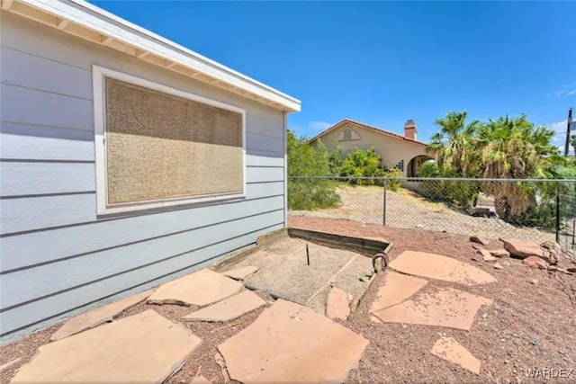 view of patio featuring fence