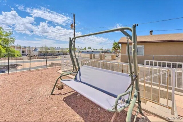 view of home's community with fence