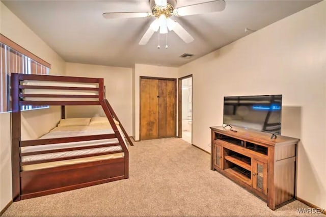 bedroom with baseboards, ceiling fan, visible vents, and light colored carpet