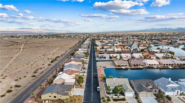 aerial view with a residential view and a water and mountain view