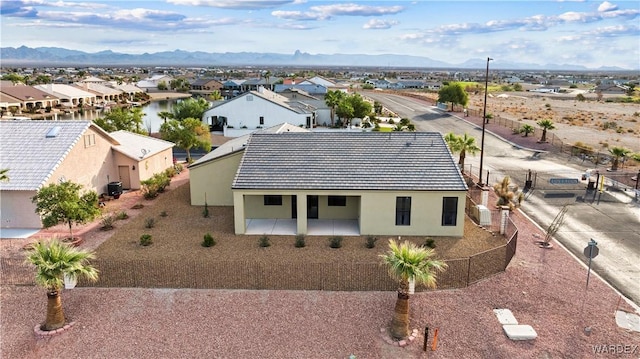 drone / aerial view with a residential view and a mountain view