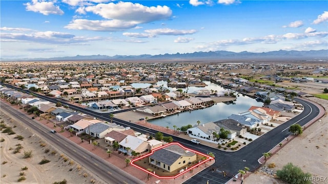 birds eye view of property featuring a residential view and a water and mountain view