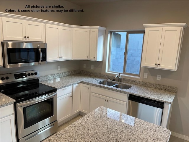 4933 N Famoso Dr, Kingman, AZ 86409 - kitchen featuring appliances with stainless steel finishes, a sink, and white cabinetry