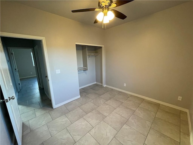 4933 N Famoso Dr, Kingman, AZ 86409 - unfurnished bedroom with baseboards, a closet, a ceiling fan, and light tile patterned flooring
