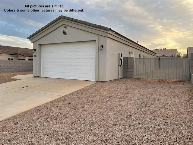 4933 N Famoso Dr, Kingman, AZ 86409 - garage at dusk featuring fence