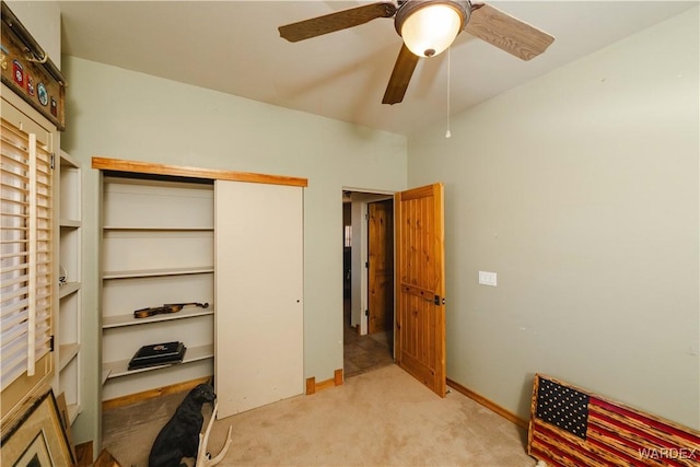 bedroom with light carpet, a ceiling fan, and a closet