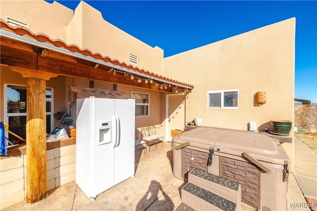 view of patio / terrace featuring visible vents